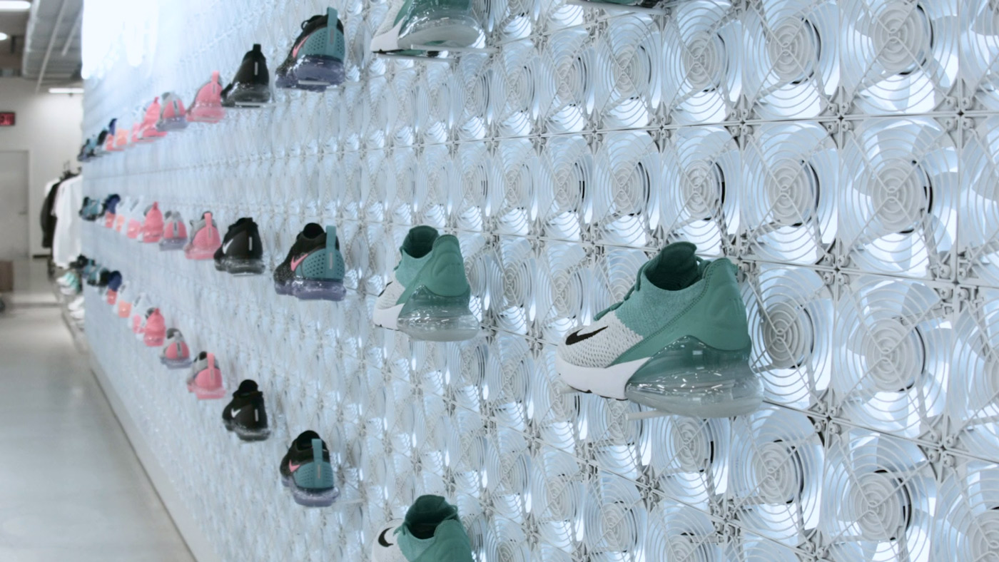 Massive display of computer fans as backdrop to retail shoe display